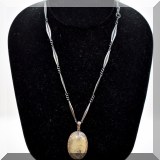 J131. Link necklace with stone pendant surrounded by diamonds.